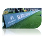 LED advertising board displaying 'Skycity Auckland' at a sports event.