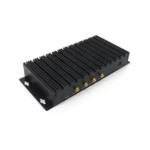 Black industrial-grade computing device with multiple ports and a ribbed exterior for heat dissipation.