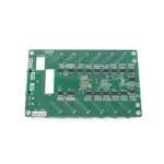 Green printed circuit board featuring various electronic components and connections.