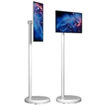 Freestanding digital display stand with a vertical screen on a white pole and base.