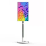 Digital display stand featuring a colorful screen with abstract design.
